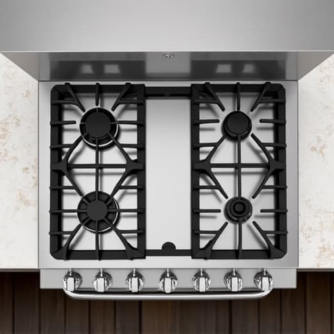 Wolf range repair in an East Sacramento kitchen. Professional Wolf appliance repair, technician focused on repairing a high-performance Wolf range, ensuring optimal function in an upscale kitchen.