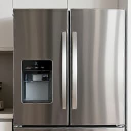Emergency appliance repair technician working on a refrigerator in Dixon, CA at night