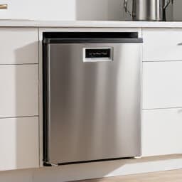 Emergency dishwasher repair service in Dixon, CA. Technician fixing a broken dishwasher with tools.